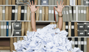 Person buried in crumpled paper