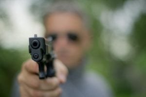 Man stands his ground with gun in hand