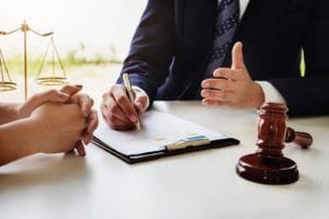 woman consulting a lawyer to file a lawsuit