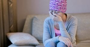 A female cancer patient is crying