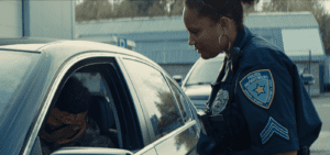 A female police officer talking to a car driver