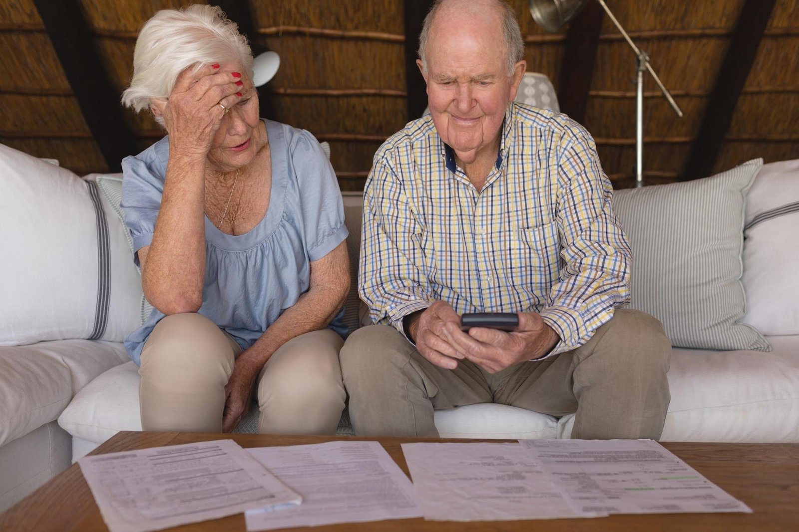 Elderly couple discussing and computing their hospital bills