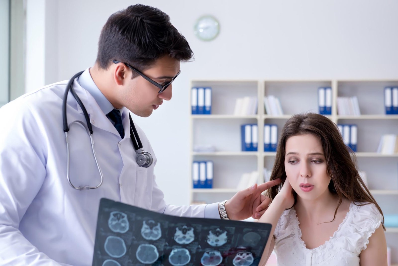 Woman consulting her doctor about her neck injury
