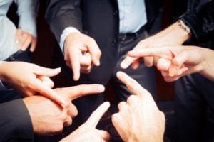 Group of people pointing fingers at each other