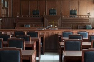 Empty courtroom with tables and chairs