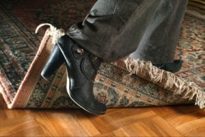 Person tripping on a rug