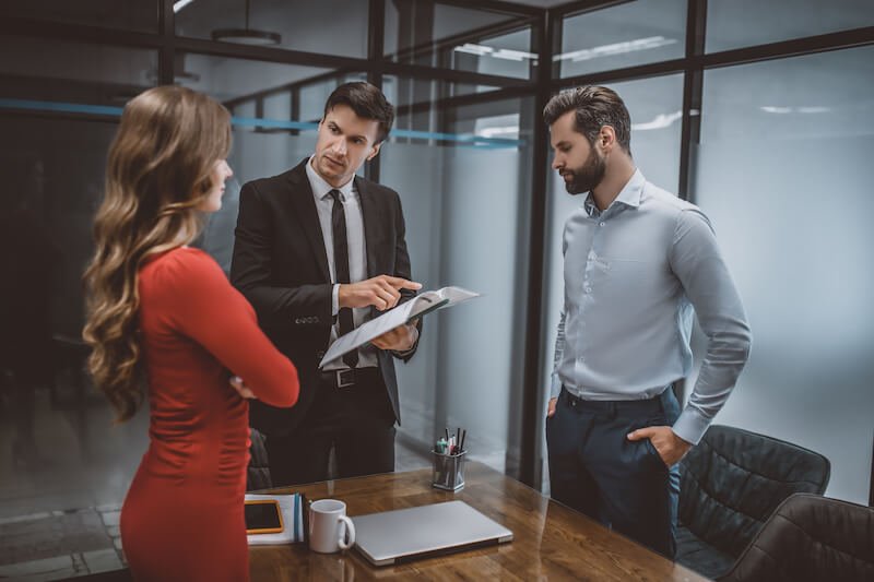 Lawyer discussing a settlement claim to clients
