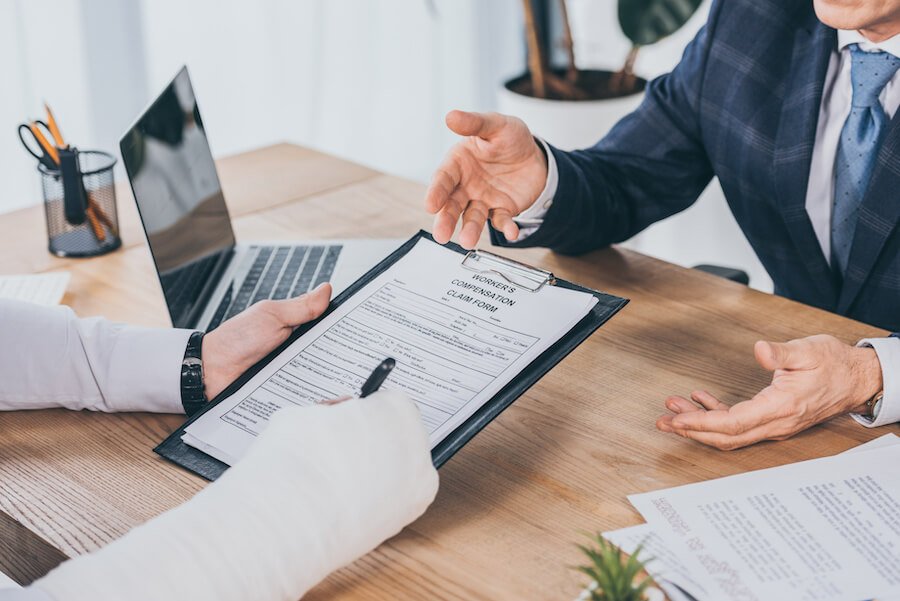 Injured man submitting a claim form to his lawyer
