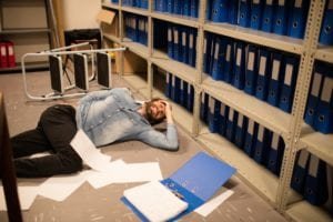 Man in pain, lying on the floor after an accident